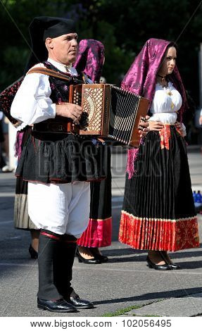Musicians With The Traditional Costume Of Sardinia.