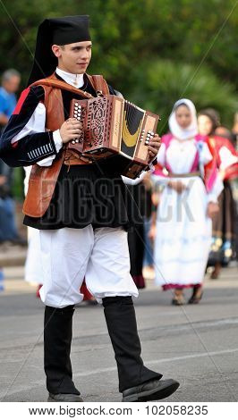 Musicians With The Traditional Costume Of Sardinia.