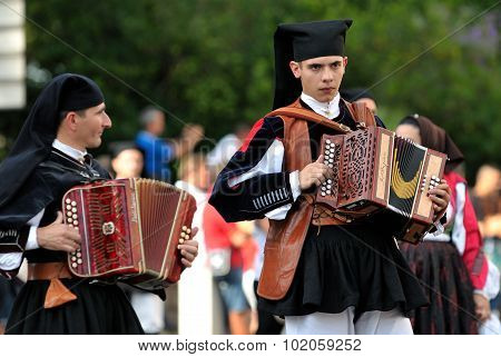Musicians With The Traditional Costume Of Sardinia.