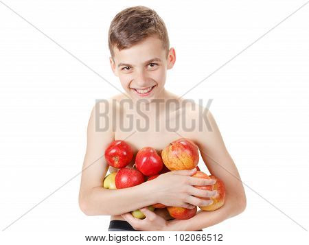 Teen boy with a pile of apples