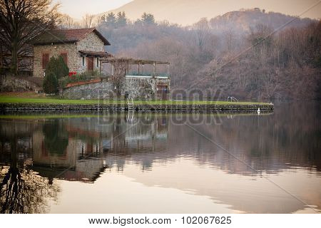 Stone Cottage On Lake, Brown Colors, Peaceful Atmosphere