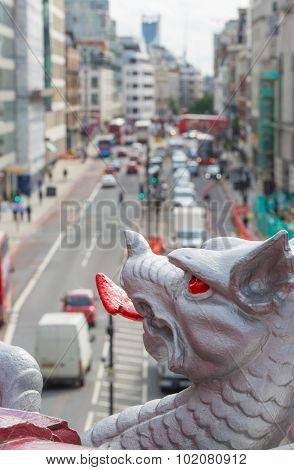 Holborn dragon close up and blurred view on the London road with ca
