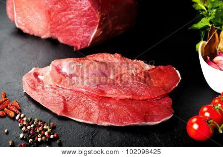 Fresh and raw meat. Still life of steaks ready for cooking, barbecue.