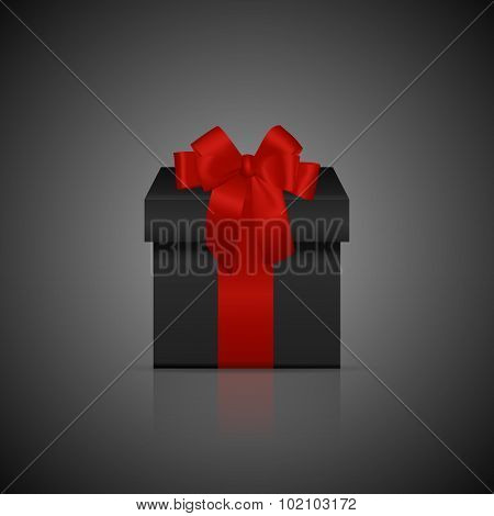 Black square gift box with red ribbon and bow