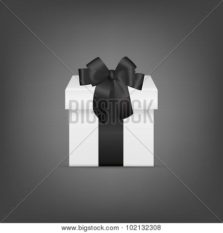 White square gift box with black ribbon and bow