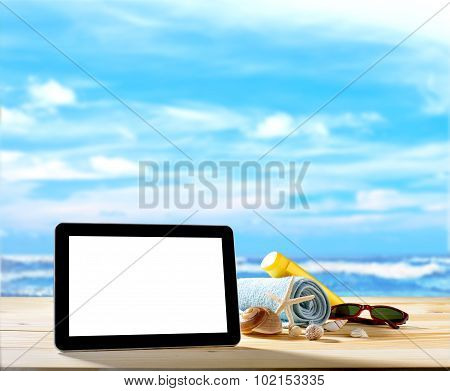 Tablet computer on sandy beach