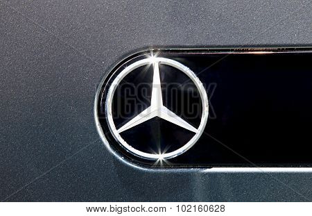 Close Up Logo Of Mercedes Benz On Black Car