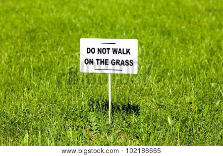 Notice Board On The Lawn With Text 