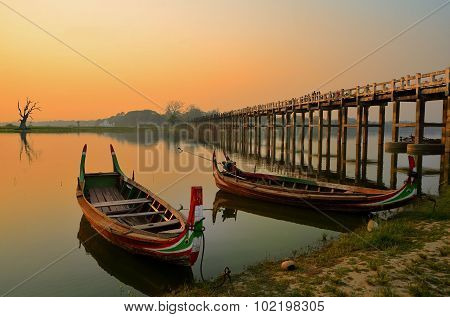 Amarapura, Myanmar - 14 March 2015: People Walking On The Wooden Bridge Of U Bein On River Ayeyarwad