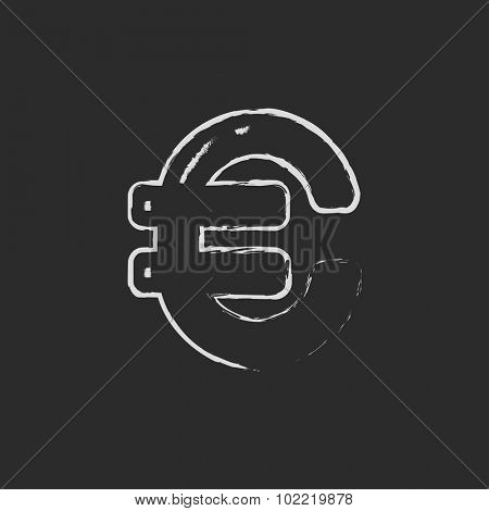 Euro symbol hand drawn in chalk on a blackboard vector white icon isolated on a black background.