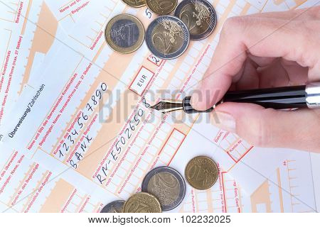 Female Hand Filling Remittance Slip