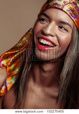 beauty young afro american woman in shawl on head smiling close up swag