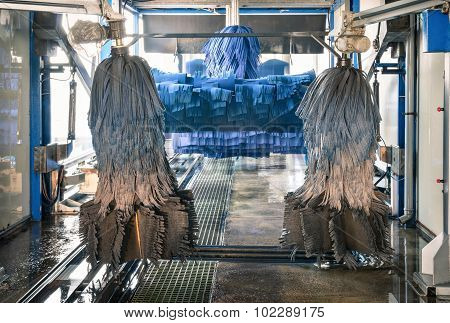 Modern Automatic Carwash With Blue Brushes