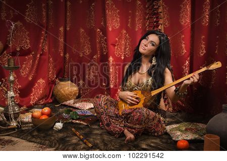 Beautiful Woman Playing The Dombra
