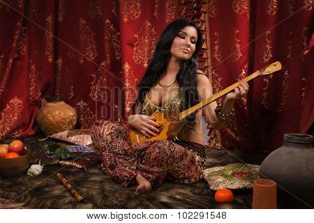 Beautiful Woman Playing The Dombra