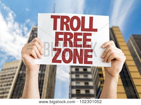 Troll Free Zone placard with skyscrappers background