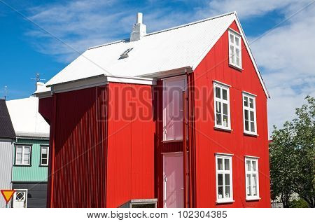 Red house with white roof