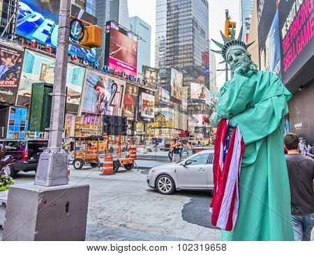 NEW YORK, USA - Sept 18th, 2015: Street performer dressed as Statue of Liberty in New York's busy Times Square