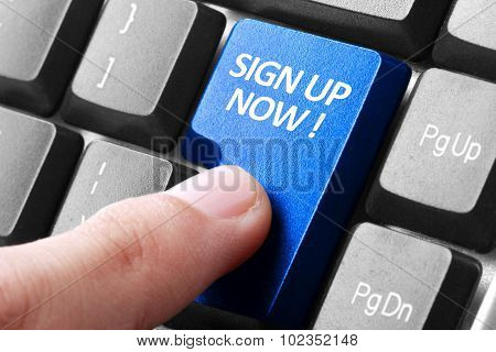Hand Press Sign Up Now Button On Keyboard