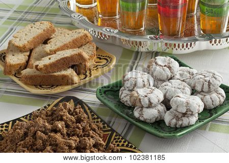 Traditional Moroccan homemade cookies and sellou with tea