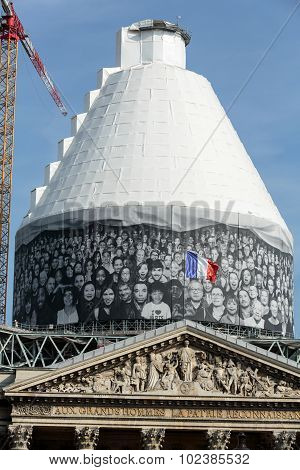 PARIS, FRANCE - SEPTEMBER 8, 2014: Paris - The pediment of Pantheon against the background of repaired dome. Construction of the building started in 1757 and was finished in 1791