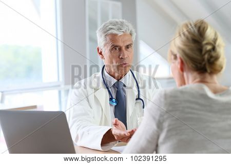 Doctor having consultation with patient in office