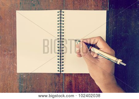 Hands With Pen Writing On Notebook