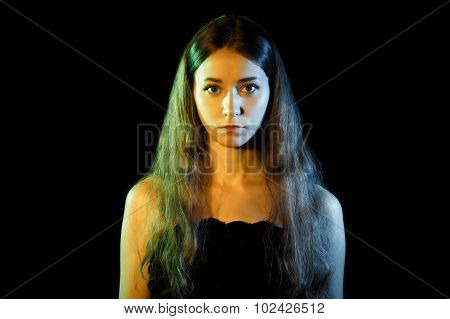 Beautiful Young Woman In Blue And Yellow Lights
