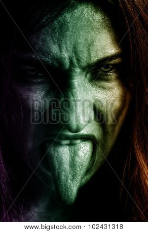 Evil spooky woman with scary horror face 
