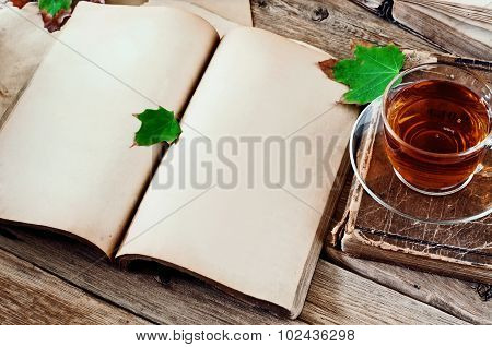 Open Book With Blank Pages And A Cup Of Tea