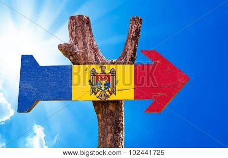 Moldova Flag wooden sign with sky background