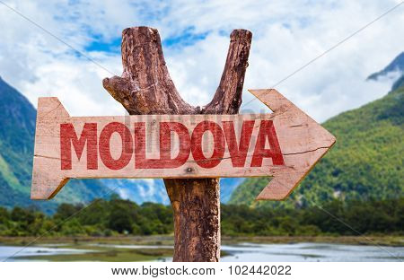 Moldova wooden sign with countryside background