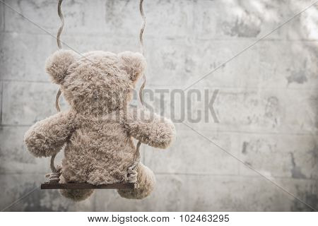 Teddybear on a swing