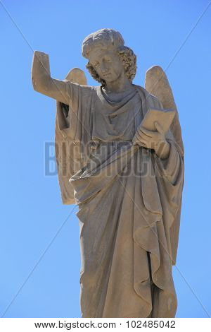 Statue of angel with broken arm