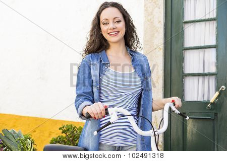 Female tourist living like a local, with her bicycle after buying fresh vegetables