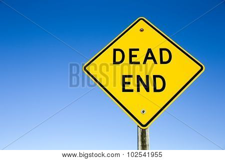 Dead End Sign Against Blue Sky