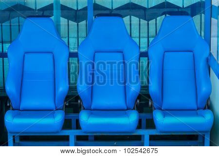 Empty Coach And Reserves Blue Bench On A Football Stadium