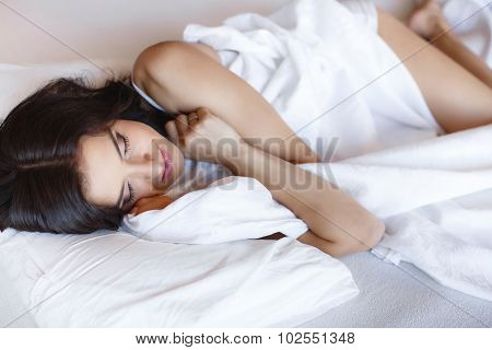 Morning portrait of beautiful woman sleeping in bed