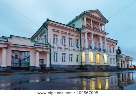 Building Reflection In A Pool Of Morning