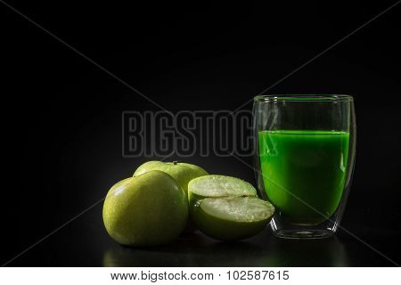 Green Apple Juice Withe Green Apples On The Black Background