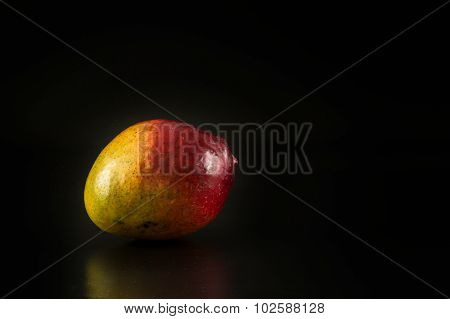 Mango Fruit On The Black Background