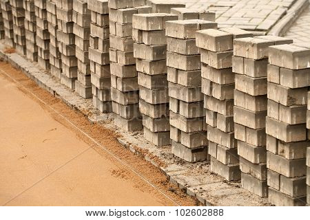 induration sand and laying paving slabs