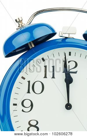 a blue alarm clock on a white background. eleventh hour