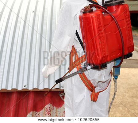 Worker During The Remediation Of Asbestos From The Roof