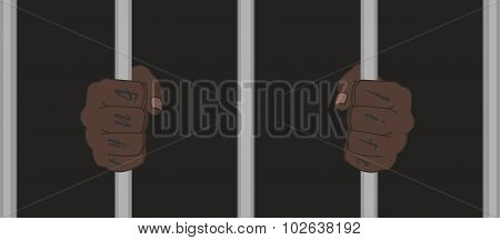 Black man fists holding prison bars