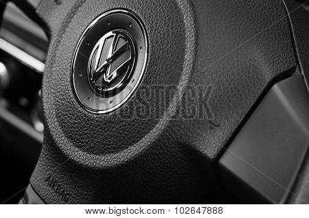 VW badge on a steering wheel