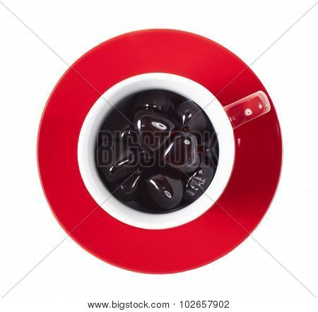 red cup on the saucer with hearts on white