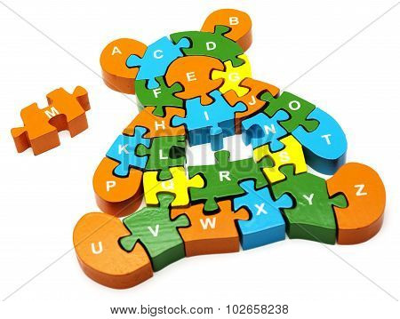 wooden colored puzzle in bear form with letters