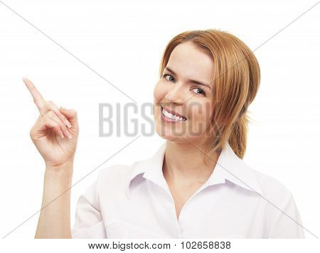 Young woman smiling and pointing to up