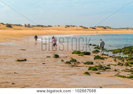 Tourist family visiting beach in Oualidia, Atlantic coast of Morocco